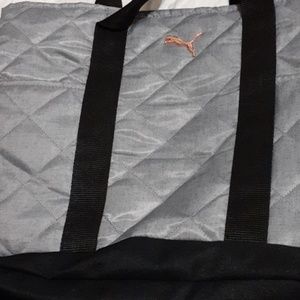 A black and grey puma bag